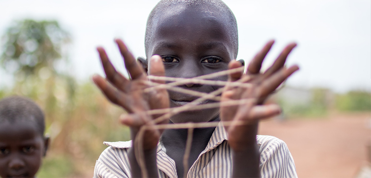 boy playing with string